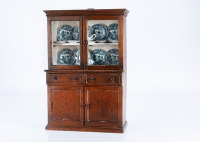 Lot 332 - A late 19th century oak doll’s dresser