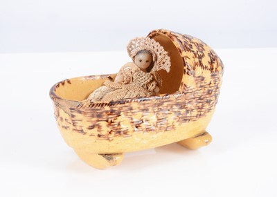 Lot 343 - An 19th century spongeware pottery dolls’ house cradle