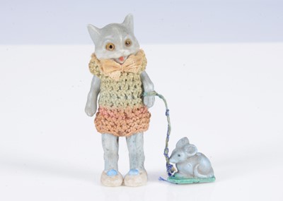 Lot 346 - A rare Hertwig bisque dolls’ house boy cat doll