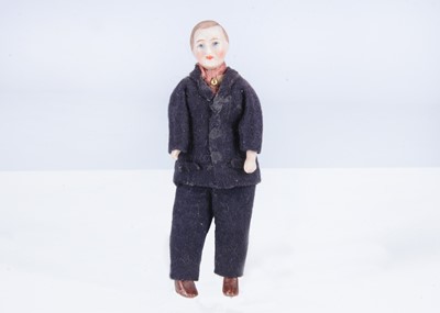 Lot 348 - A 1920s German bisque shoulder-head dolls’ house father doll