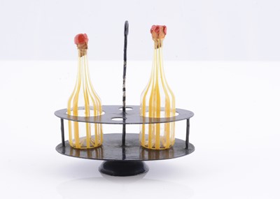 Lot 350 - An 19th century German dolls’ house decanters in stand