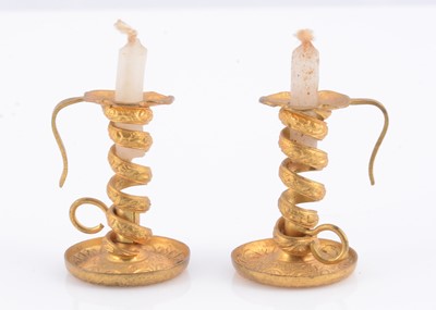 Lot 357 - A pair of German gilt metal dolls’ house chambersticks