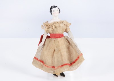 Lot 373 - An 19th century German china shoulder-head dolls’ house girl doll