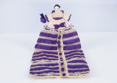 Lot 376 - An 19th century German china shoulder-head dolls’ house doll sewing practise doll