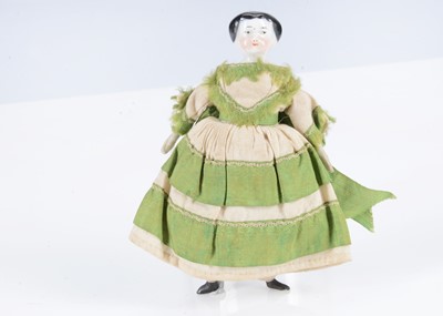 Lot 377 - An 19th century German china shoulder-head dolls’ house girl doll