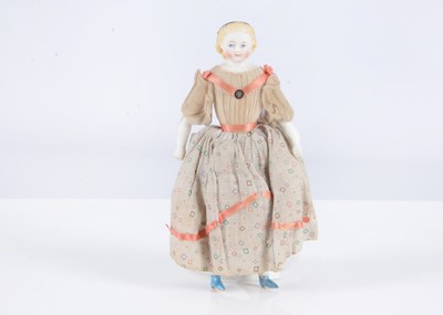 Lot 378 - A rare 19th century German bisque shoulder-head dolls’ house doll