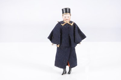 Lot 380 - An early 20th century German bisque shoulder-head dolls’ house coachman