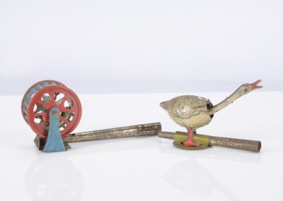 Lot 390 - Two German Penny Toy whistles
