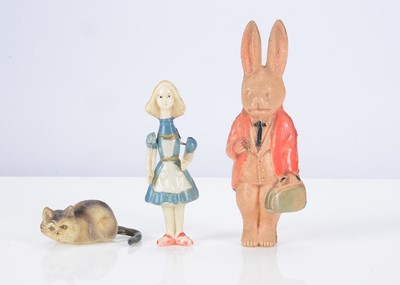 Lot 396 - Three celluloid Alice in Wonderland figures