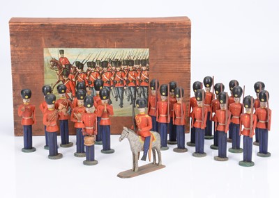 Lot 400 - A late 19th century Erzgebirge or Seiffen painted wooden British guardsmen