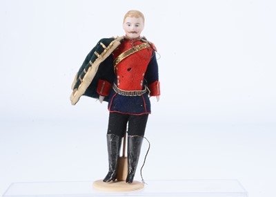 Lot 403 - A fine German bisque shoulder-head dolls’ house soldier doll