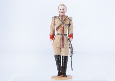 Lot 404 - A fine German bisque shoulder-head dolls’ house older soldier doll