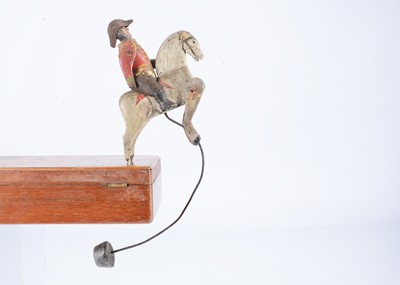 Lot 406 - A rare early 19th century wooden mounted soldier balancing toy