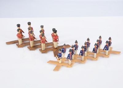 Lot 416 - Two early 19th century Erzgebirge wooden military scissor toy