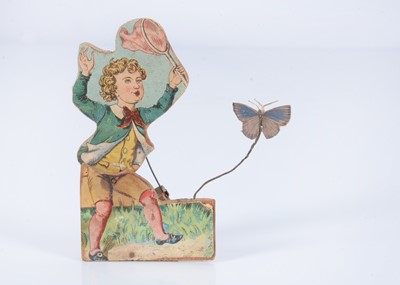 Lot 422 - A late 19th century articulated squeak toy of a boy catching a butterfly
