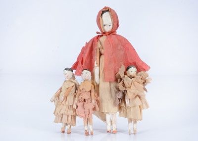 Lot 424 - Four German peg wooden dolls, circa 1900