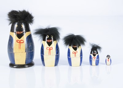 Lot 428 - A German painted wooden Golliwog nesting dolls, circa 1910