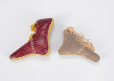 Lot 437 - Two 19th century boot pin cushions