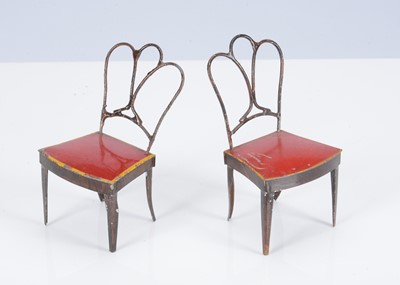 Lot 444 - Two 19th century Rock & Graner painted tinplate dolls’ house dining chairs