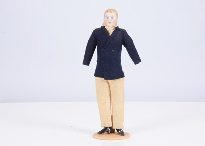 Lot 455 - A late 19th century German bisque shoulder-head gentleman doll