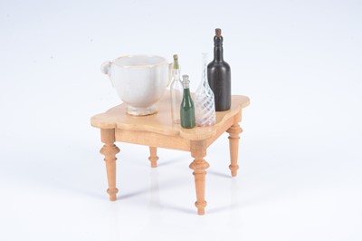 Lot 466 - An 19th century German blonde wood dolls’ house table