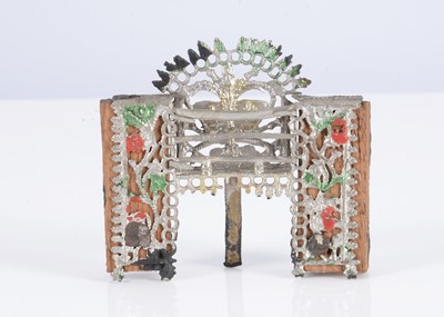 Lot 484 - A small early 19th or late 18th century Bielefeld soft metal dolls’ house fireplace