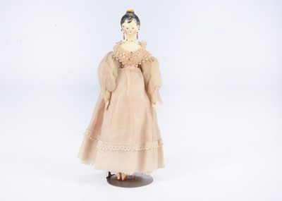 Lot 499 - An 19th century Grodnertal wooden doll