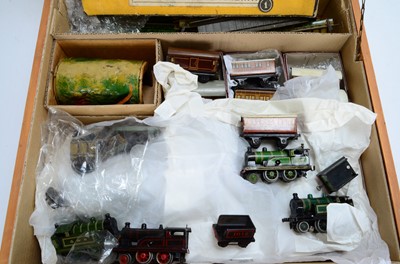 Lot 426 - A large Bing and K Bub Table Top 00/HO Gauge made up Clockwork and Electric Train set with 4 Locomotives Goods and Passenger stock and Accessories and Track in purpose made wooden box (qty)