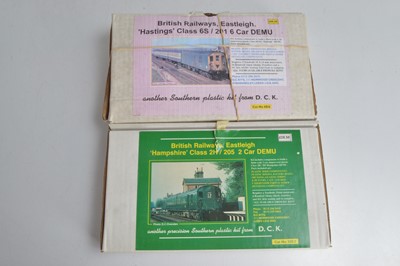 Lot 459 - DCK 00 Gauge boxed unmade BR DEMU 'Hampshire' 2-Car and Hastings 6-Car kits both with motors wheelsets and seating (2)