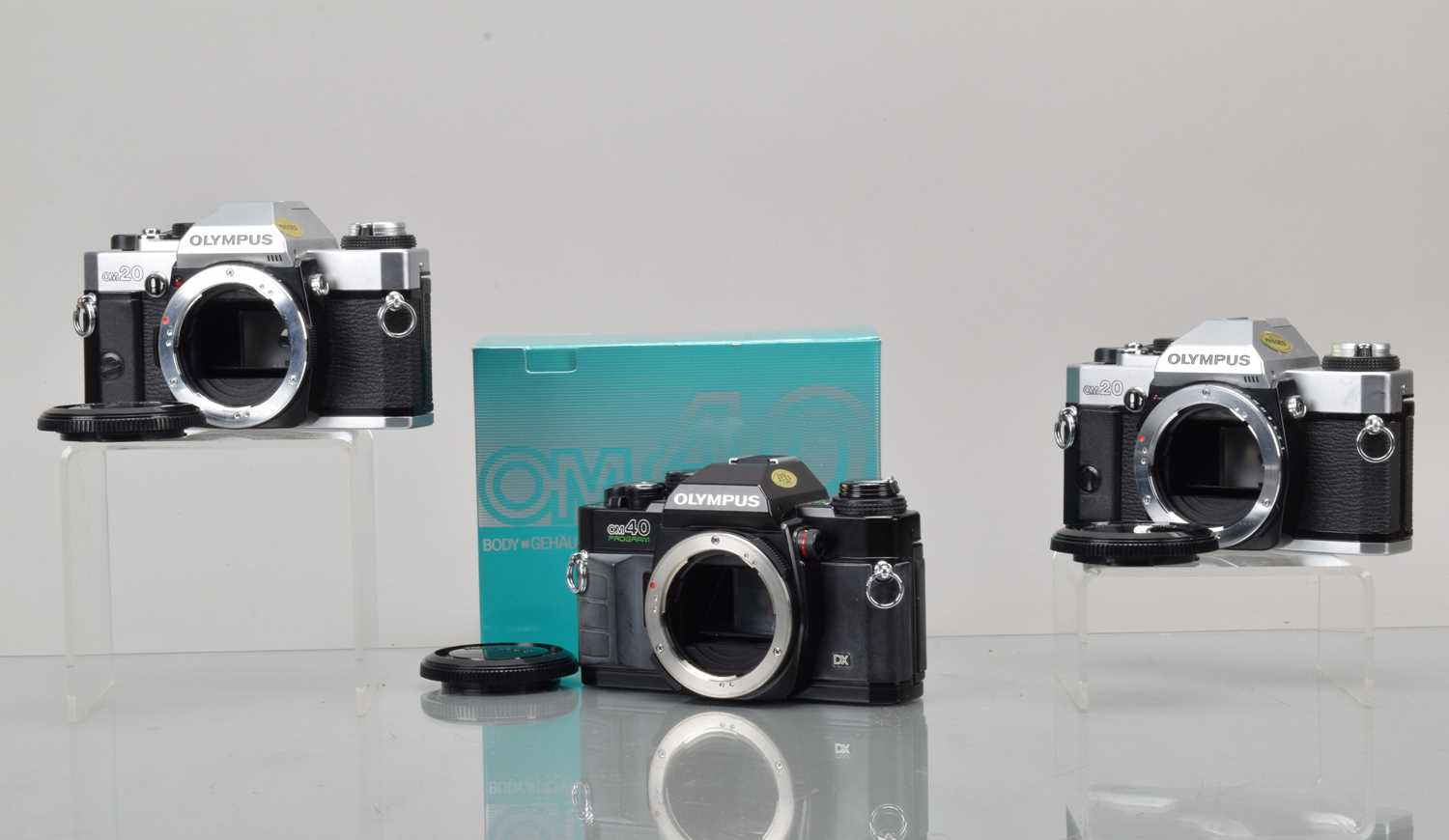 Lot 90 - Three Olympus SLR Camera Bodies