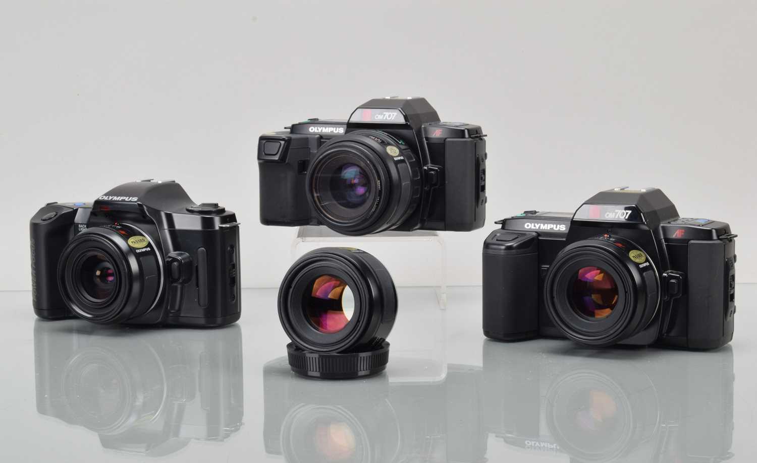 Lot 94 - Four Olympus OM AF SLR Cameras