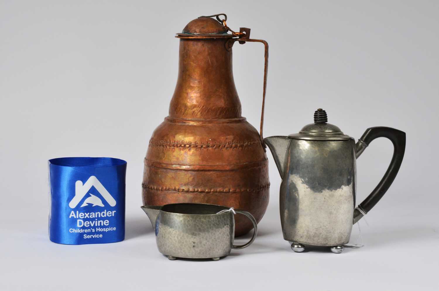Lot 1 - A middle eastern hand beaten copper jug and other items