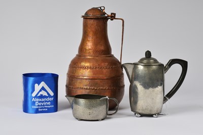 Lot 1 - A middle eastern hand beaten copper jug and other items