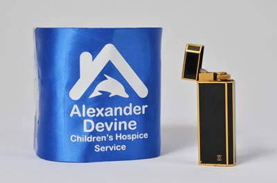 Lot 3 - A gold plated and black enamel Cartier lighter