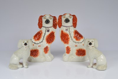 Lot 57 - Two sets of Staffordshire pottery dogs