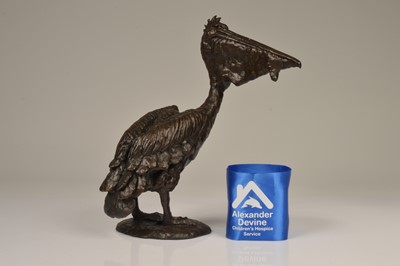Lot 142 - A resin figure of a pelican with fish