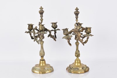 Lot 302 - A pair of Rococo-Style Brass Candelabras