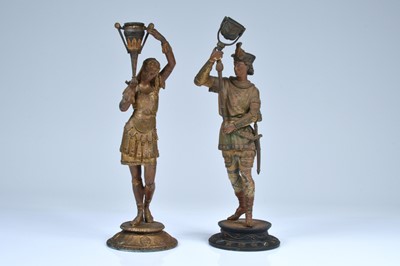 Lot 317 - A pair of spelter figural candlestick holders