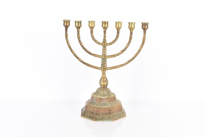 Lot 335 - A heavy brass seven branch Menorah