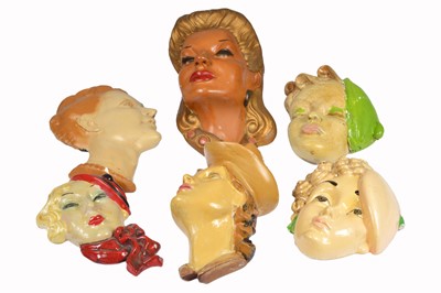 Lot 383 - A collection of six Art Deco female wall masks