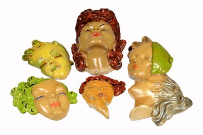 Lot 384 - A collection of six Art Deco female wall masks