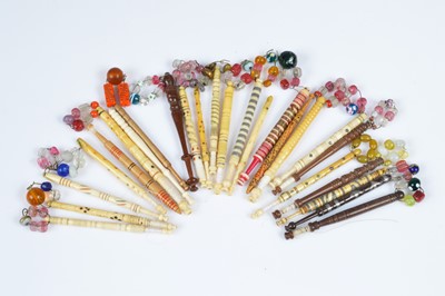 Lot 466 - A collection of twenty five wooden and bone lace bobbins