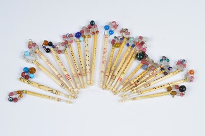 Lot 467 - A collection of twenty three named bobbins