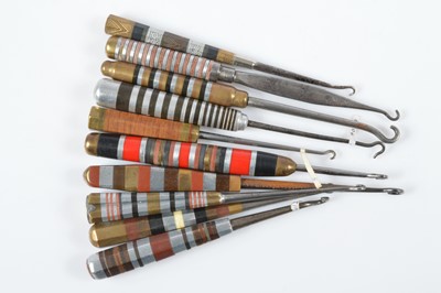 Lot 510 - A collection of Art Deco button hooks