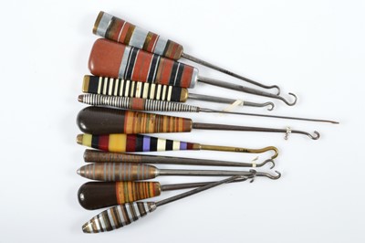 Lot 511 - A collection of Art Deco button hooks