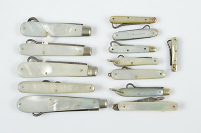 Lot 514 - A collection of 19th Century mother of pearl handled retractable button hooks