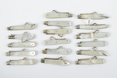 Lot 516 - A collection of 19th Century mother of pearl handled retractable silver button hooks