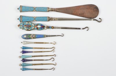 Lot 517 - A collection of 19th Century wire enamelled button and glove hooks