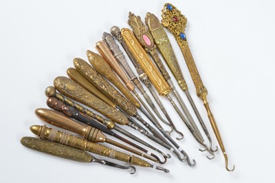 Lot 519 - A collection of late 19th and early 20th Century brass and gilt metal button hooks