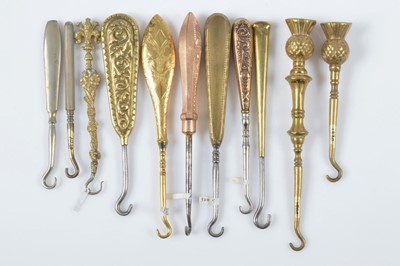 Lot 520 - A collection of late 19th and early 20th Century brass and gilt metal button hooks